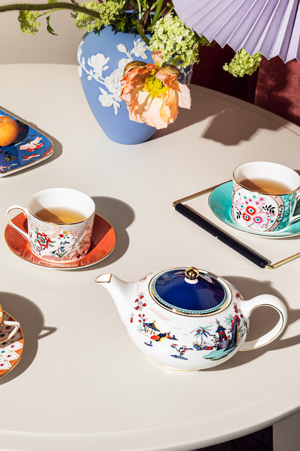 Cups and saucers, tiles, three fake books, two vases, high quality two bowls,