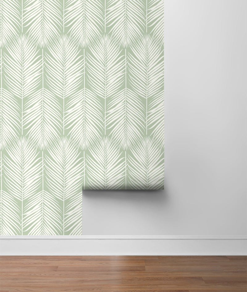 media image for Palm Silhouette Peel-and-Stick Wallpaper in Pastel Green by NextWall 252