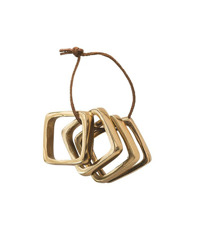 product image of square metal napkin rings on leather tie in brass finish design by bd edition 1 57